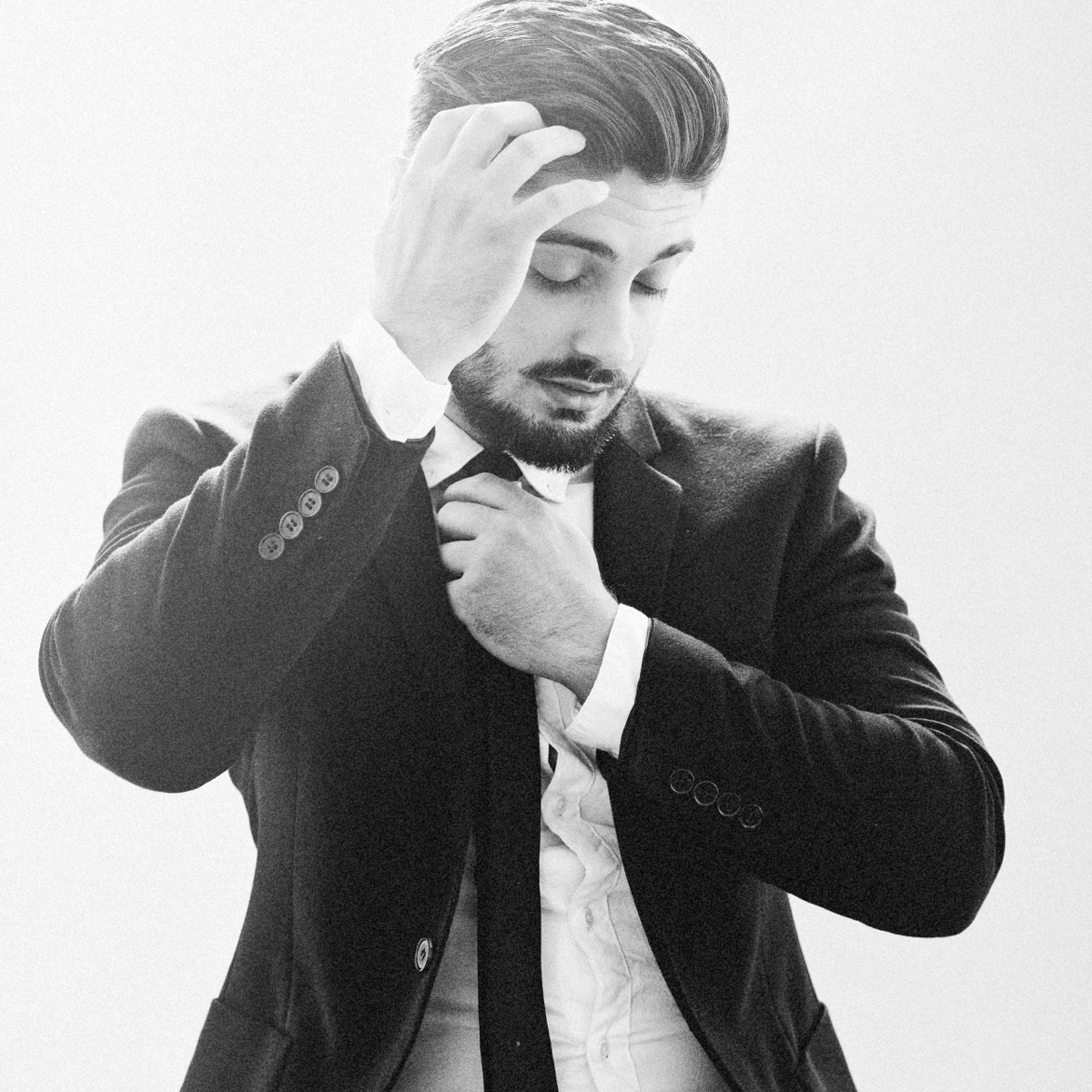 Black and white portrait of a man in a suit