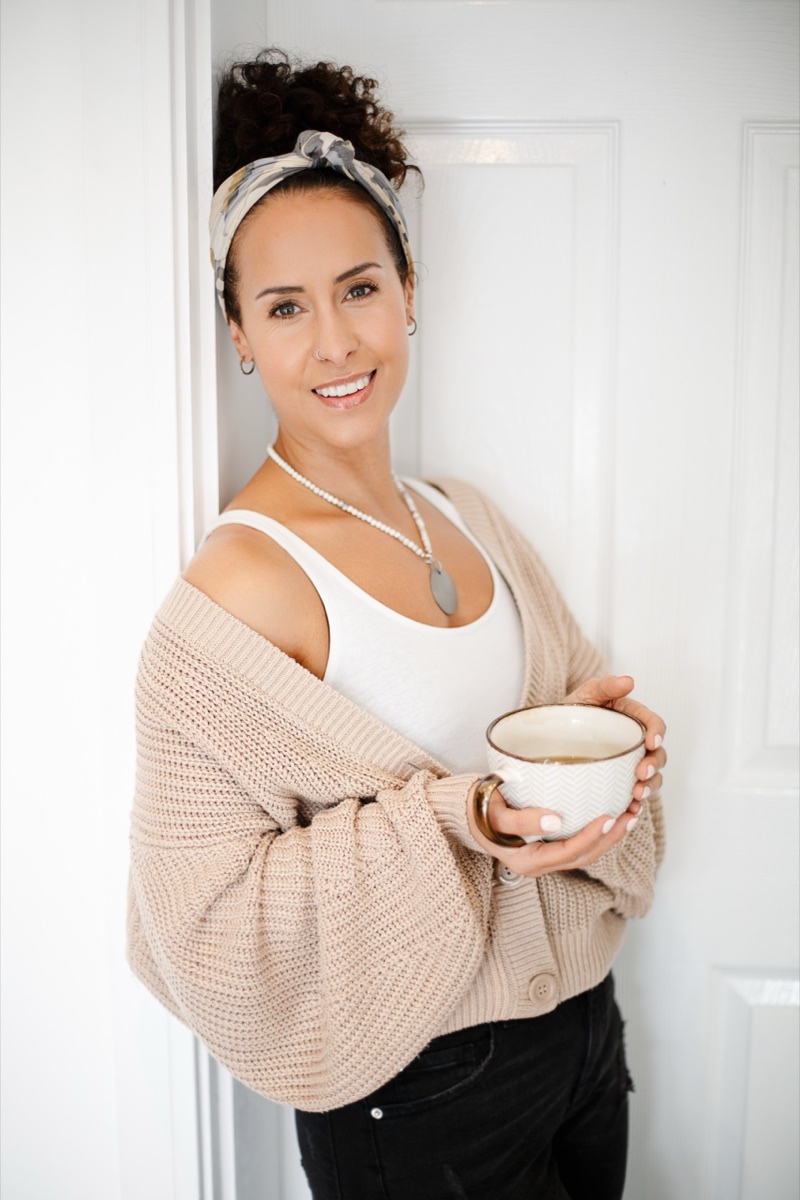 Personal branding portrait of a woman holding a cup of tea