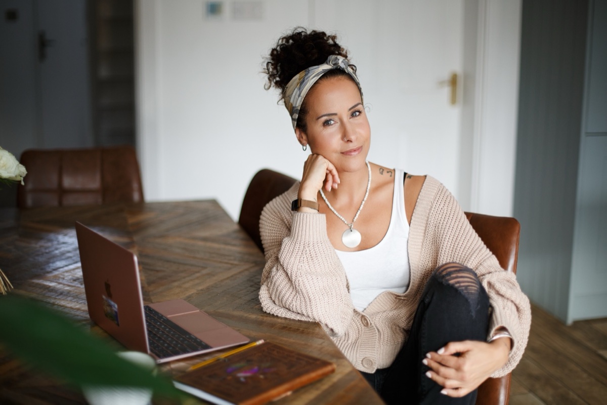 Entrepreneur at her laptop during a personal branding session
