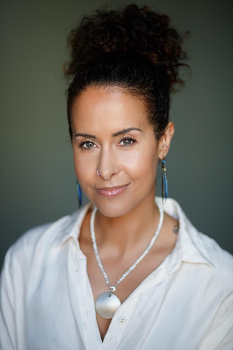 Personal branding headshot against a dark green background