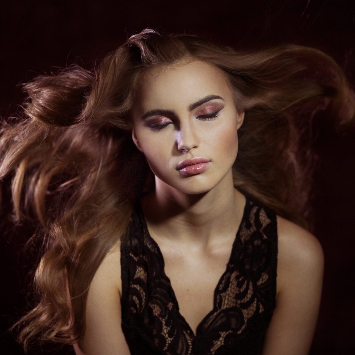 Fashion portrait with flowing hair and soft studio light