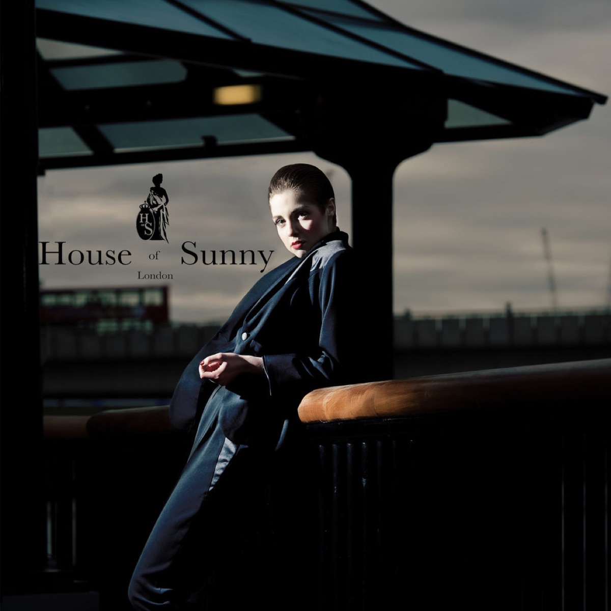 Fashion campaign portrait in a dark coat